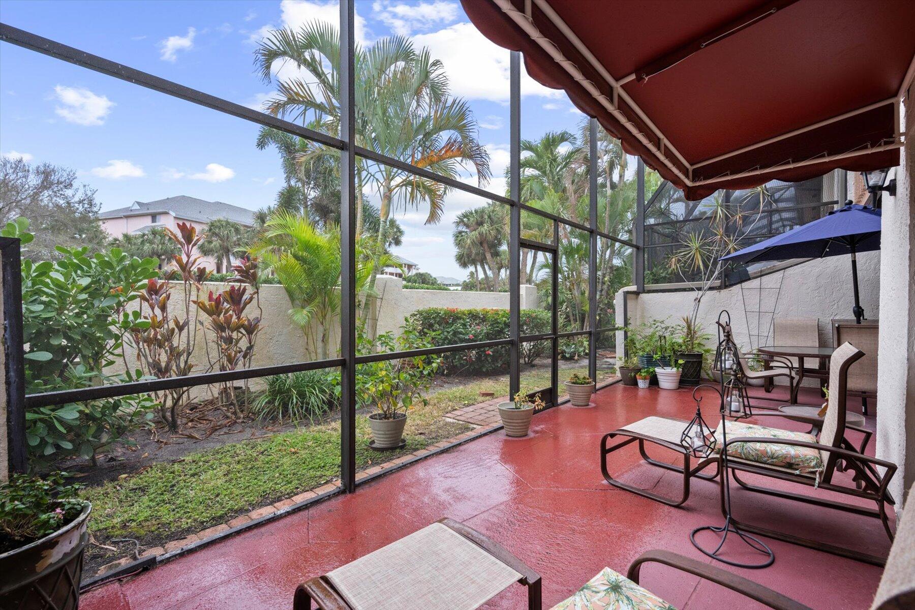 130 Palm Avenue, Unit 20 Jupiter, FL 33477 - Photo 13 of 51 a view of a porch with furniture and garden