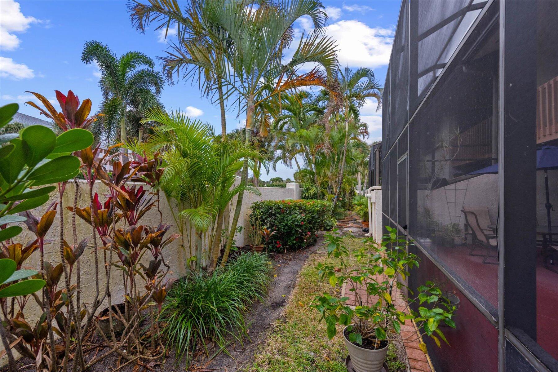 130 Palm Avenue, Unit 20 Jupiter, FL 33477 - Photo 17 of 51 a view of a garden with a flower