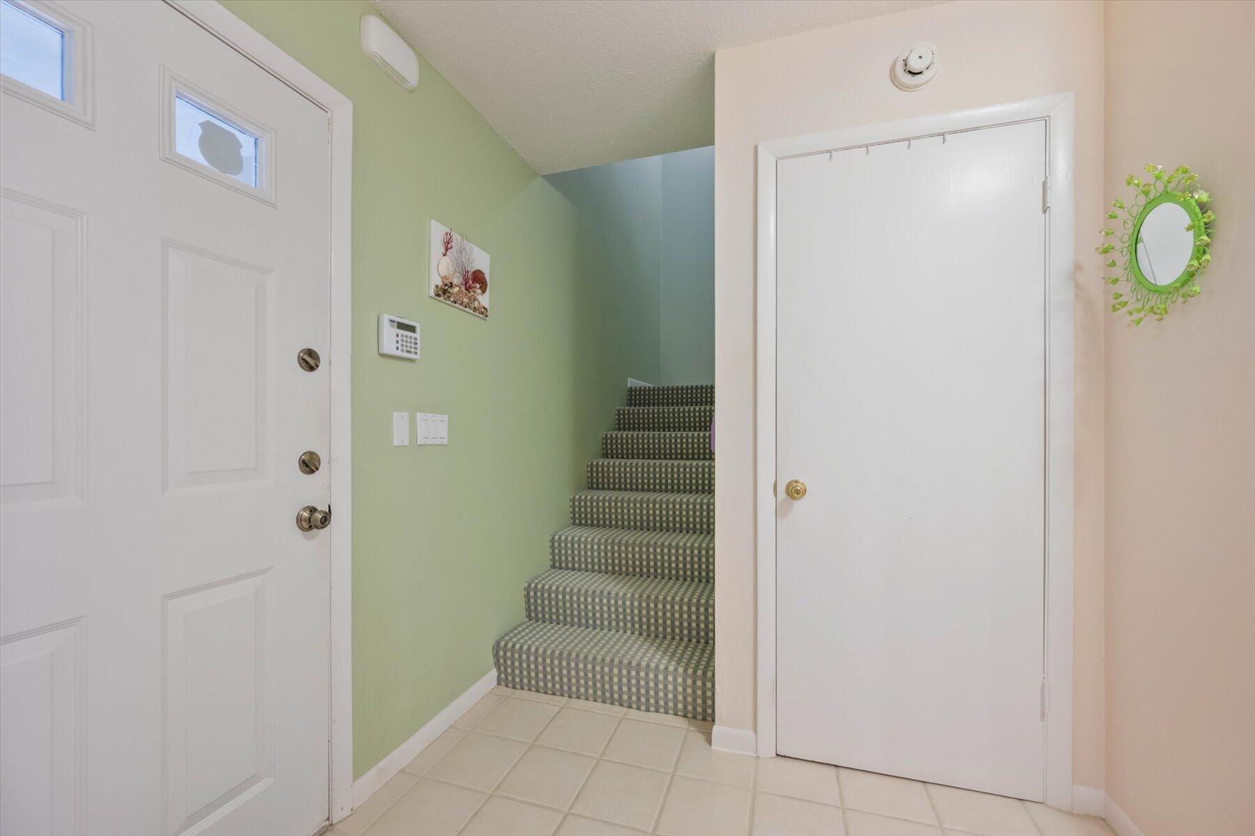 130 Palm Avenue, Unit 20 Jupiter, FL 33477 - Photo 27 of 51 a view of entryway with stairs and front door