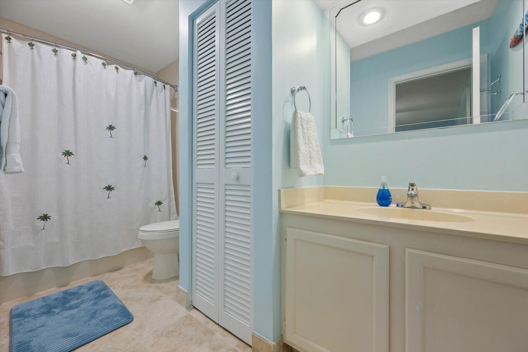 130 Palm Avenue, Unit 20 Jupiter, FL 33477 - Photo 39 of 51 a bathroom with a sink a toilet and shower