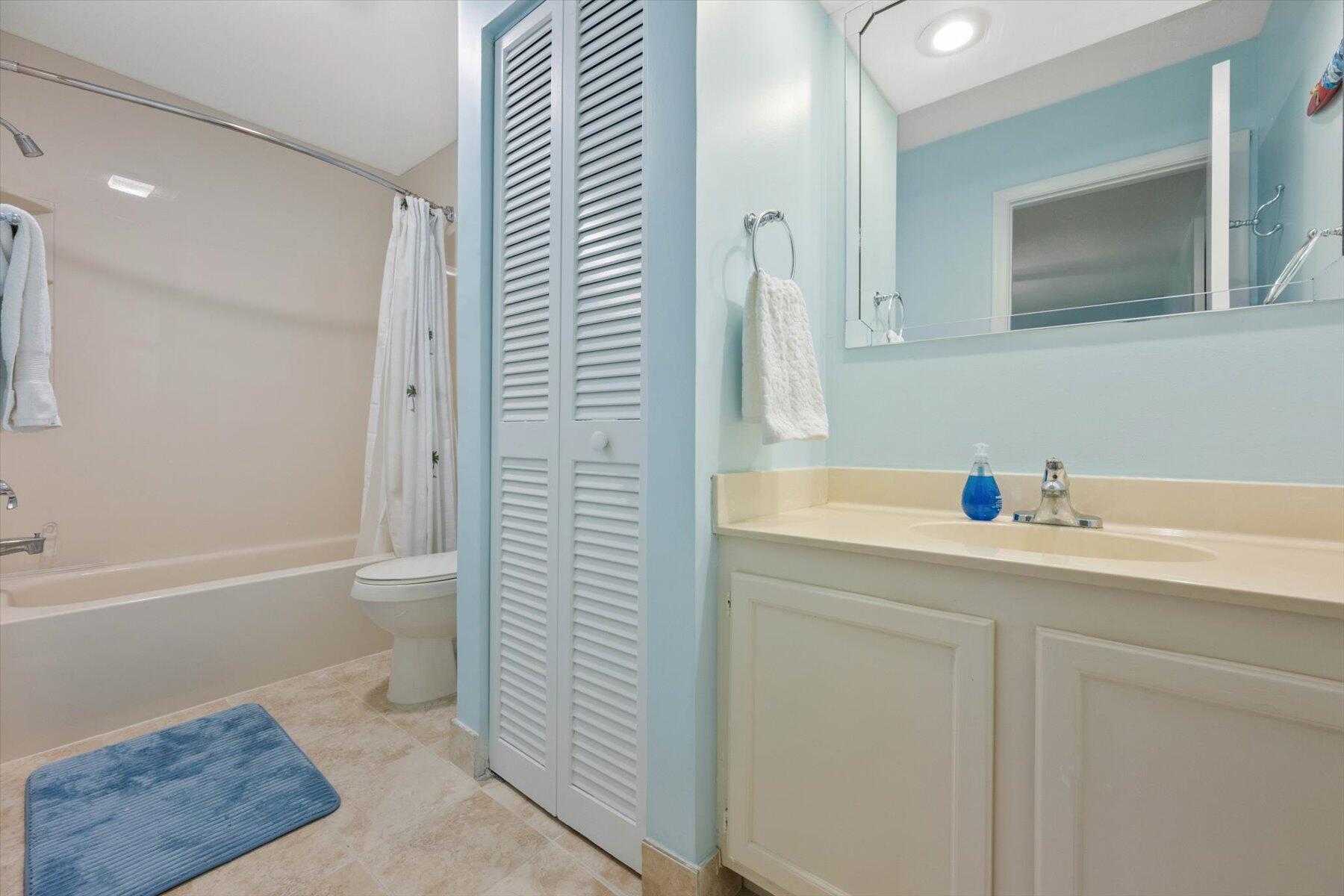 130 Palm Avenue, Unit 20 Jupiter, FL 33477 - Photo 40 of 51 a bathroom with a sink a toilet and shower