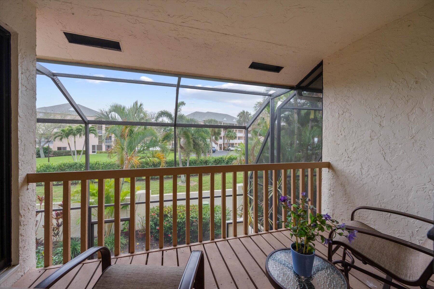 130 Palm Avenue, Unit 20 Jupiter, FL 33477 - Photo 41 of 51 a view of a porch with wooden floor