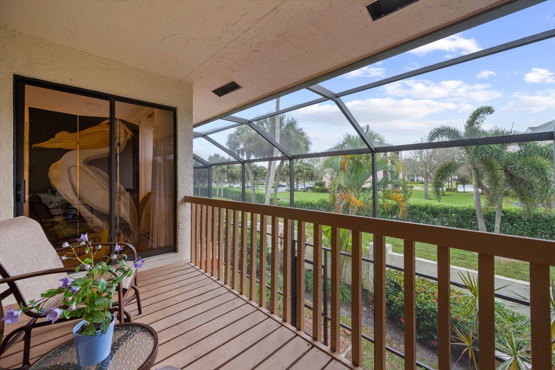130 Palm Avenue, Unit 20 Jupiter, FL 33477 - Photo 42 of 51 a view of a porch with wooden floor