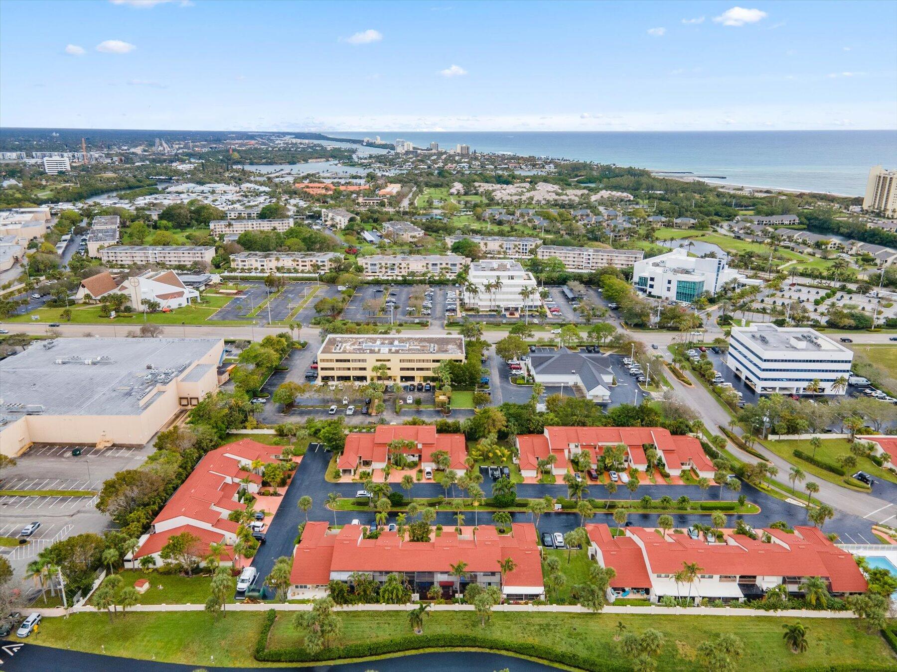130 Palm Avenue, Unit 20 Jupiter, FL 33477 - Photo 49 of 51 an aerial view of residential building and ocean