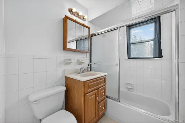 a bathroom with a sink toilet and vanity