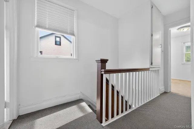 a view of a hallway with windows