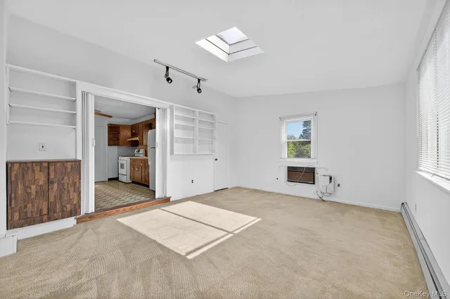 a view of an empty room with a window