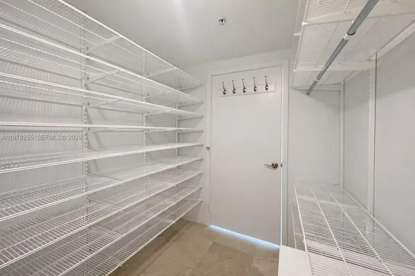 a view of an empty walk in closet