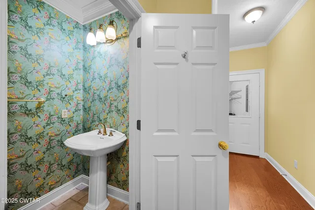 a bathroom with a sink and mirror