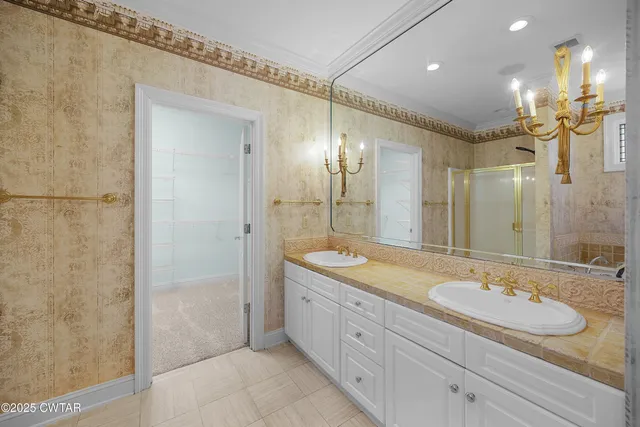 a bathroom with a granite countertop sink mirror and double