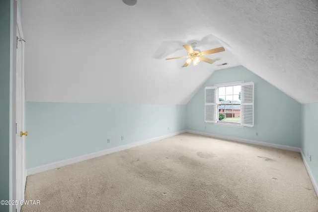 a view of a room with a window