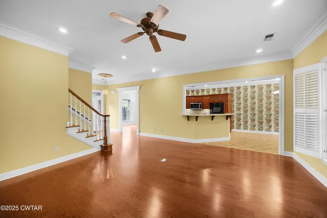 a view of an entryway with wooden floor