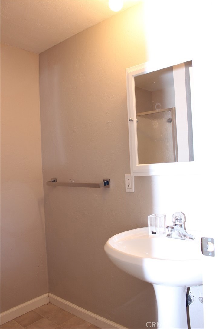 18702 East Ridge View Drive Hidden Valley Lake, CA 95467 - Photo 11 of 18 a bathroom with a sink and a mirror