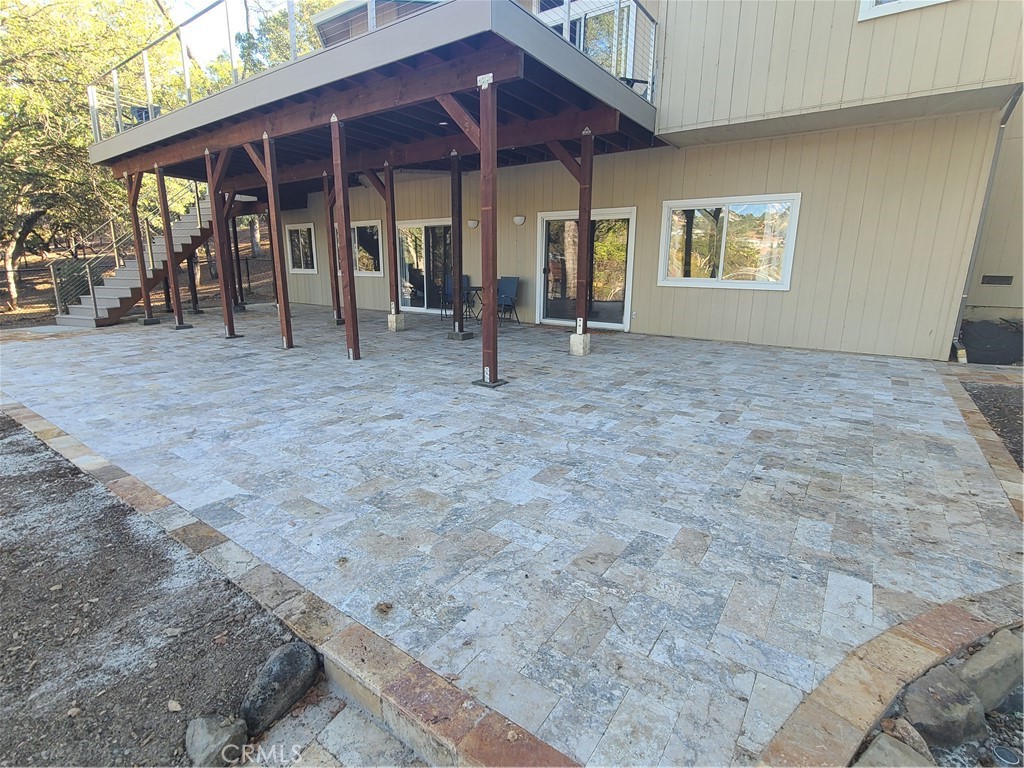 18702 East Ridge View Drive Hidden Valley Lake, CA 95467 - Photo 5 of 18 a view of a house with backyard and porch