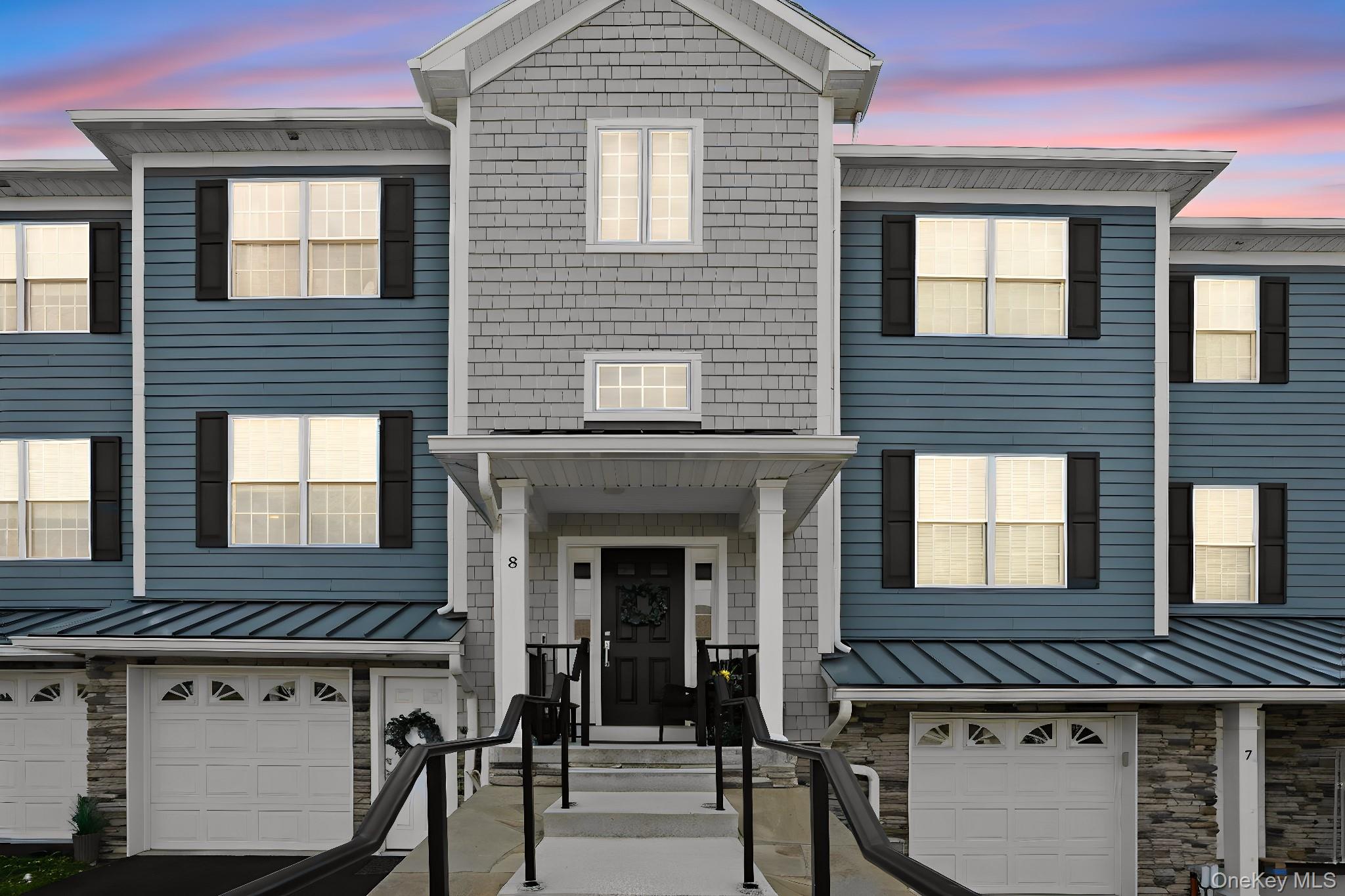 8 Muscoot River Road Granite Springs, NY 10527 - Photo 2 of 40 Multi-level townhouse exterior featuring blue horizontal siding and gray shingle-style siding