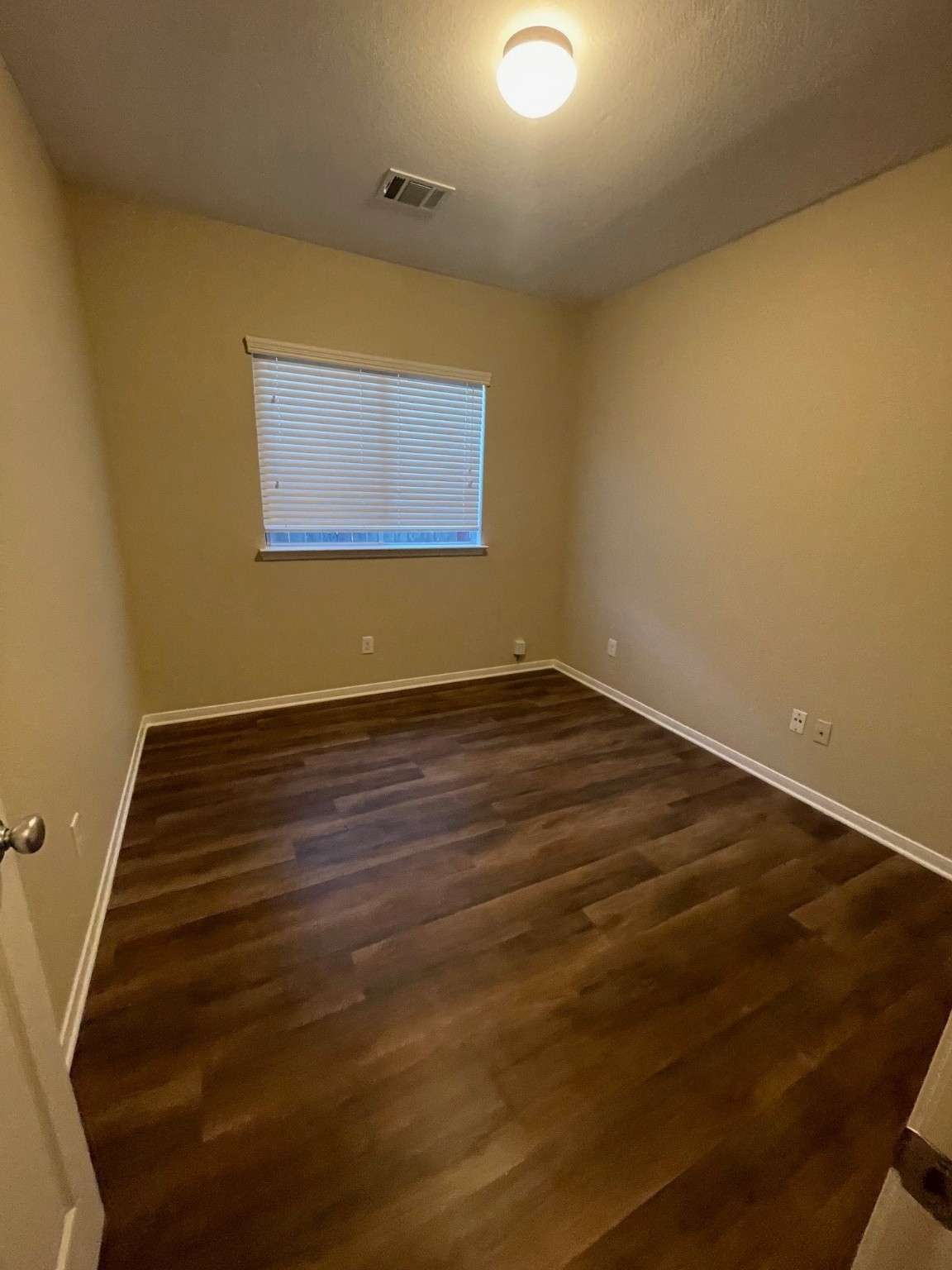 1201 Stallion Ridge Alvin, TX 77511 - Photo 16 of 29 a view of an empty room with wooden floor