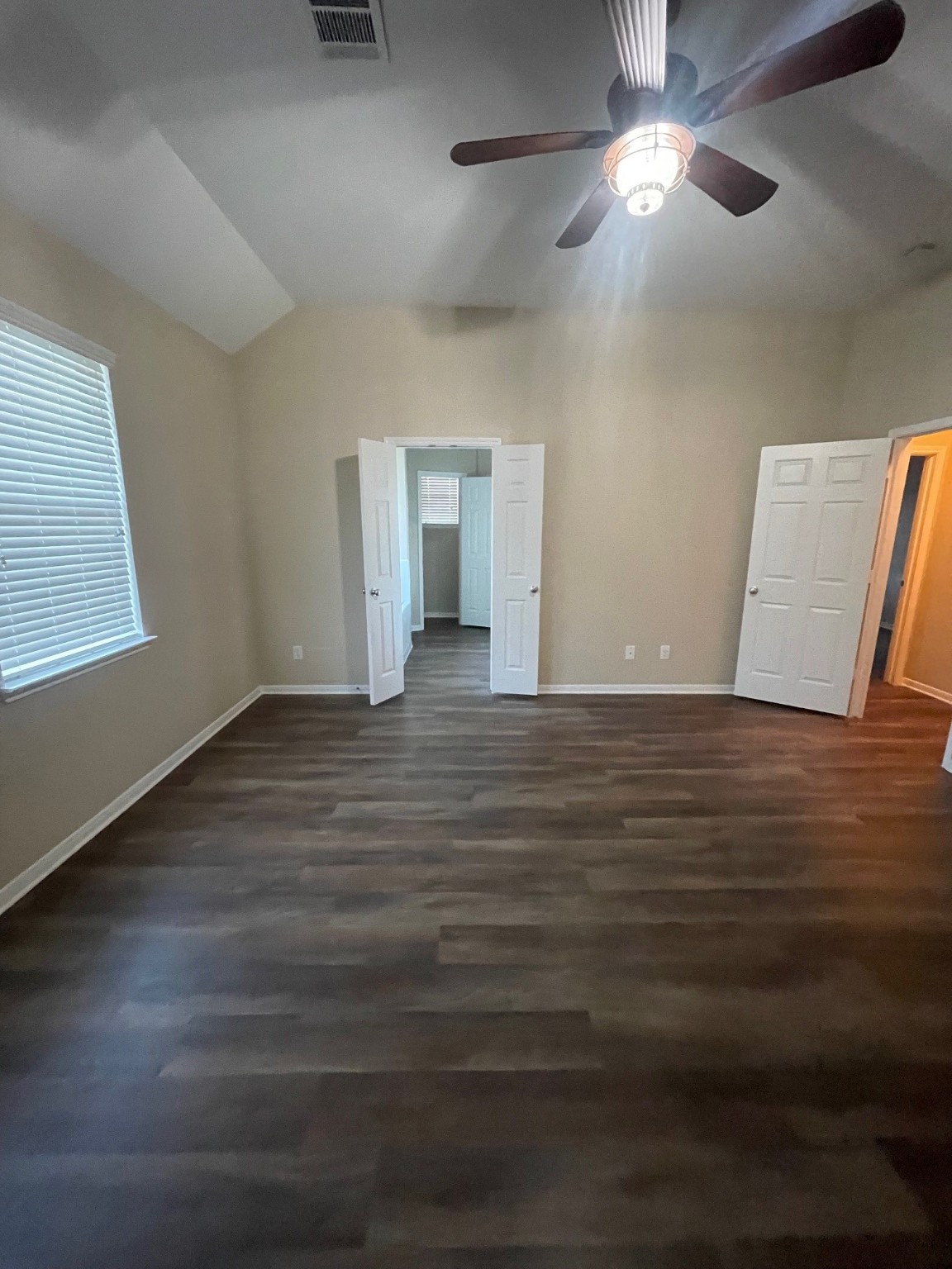 1201 Stallion Ridge Alvin, TX 77511 - Photo 19 of 29 a view of an empty room with window and wooden floor