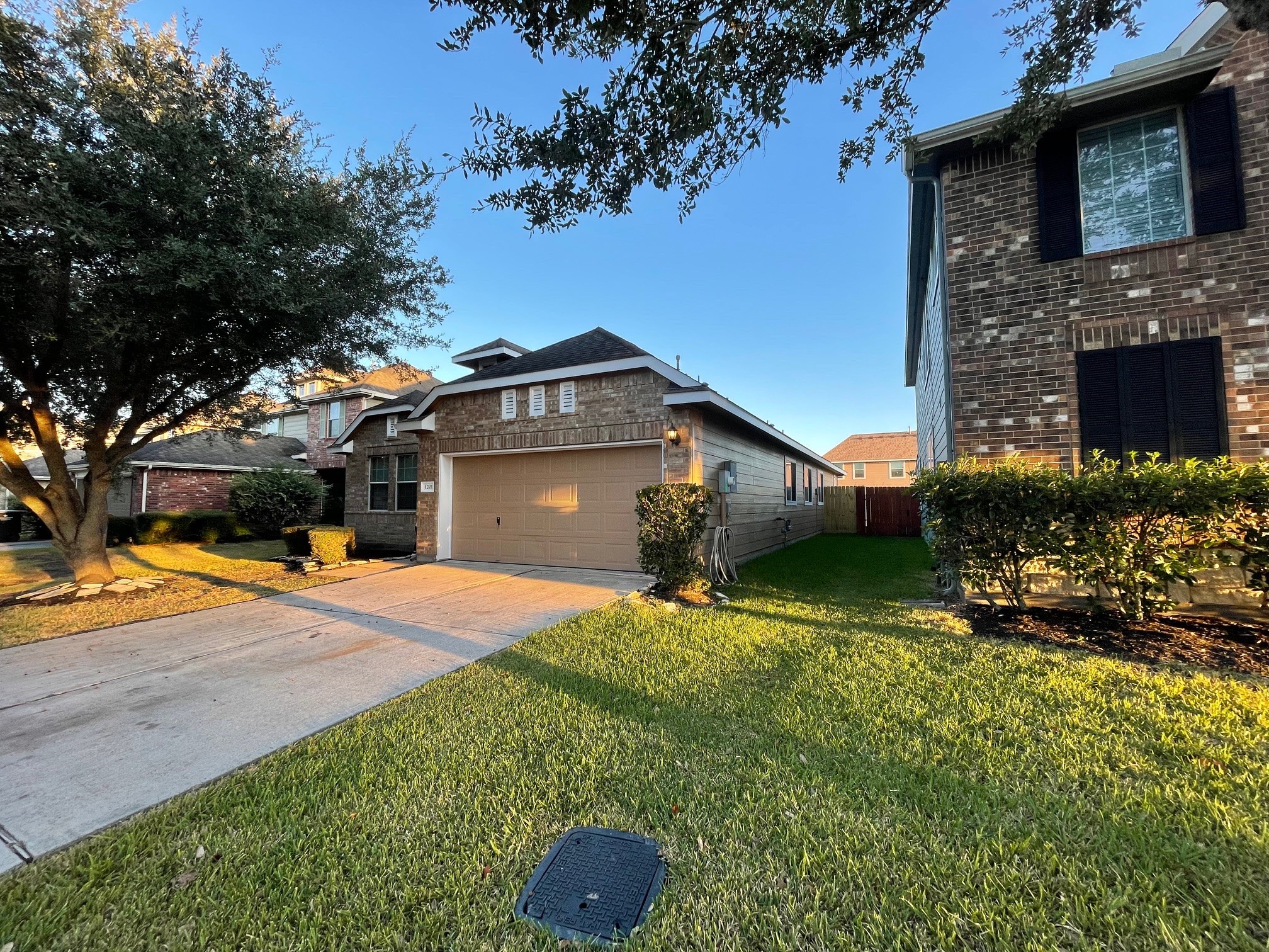 1201 Stallion Ridge Alvin, TX 77511 - Photo 3 of 29 a front view of a house with a yard and garage