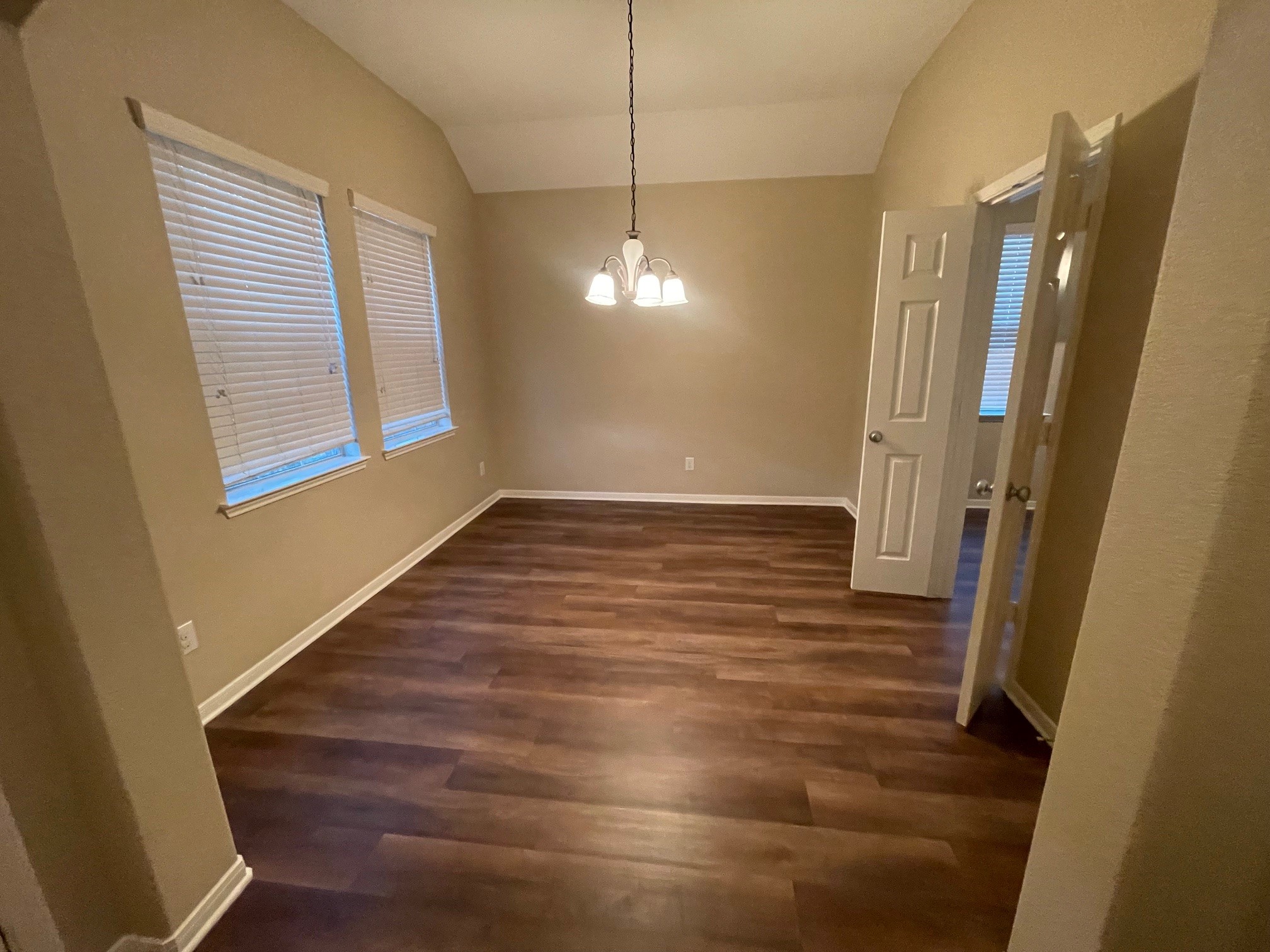 1201 Stallion Ridge Alvin, TX 77511 - Photo 4 of 29 a view of a livingroom with wooden floor and a window