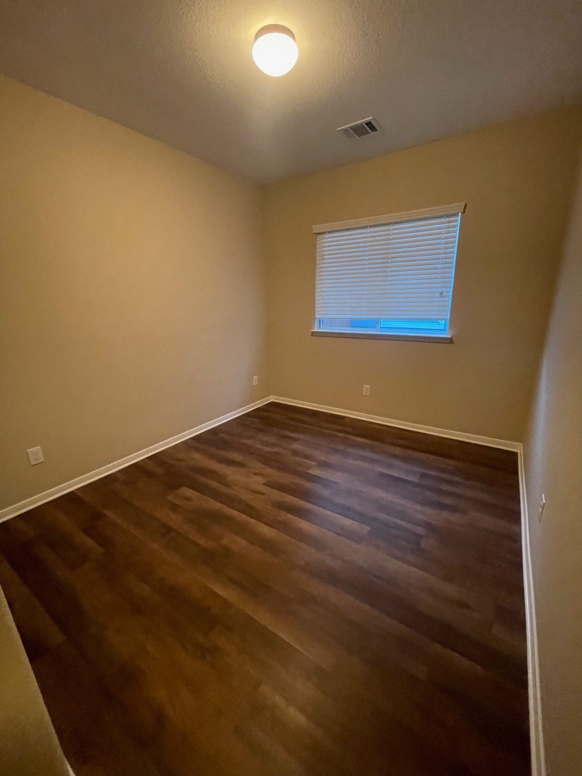 1201 Stallion Ridge Alvin, TX 77511 - Photo 10 of 29 an empty room with wooden floor
