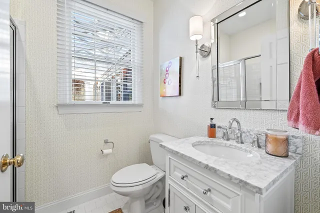 a kitchen with a refrigerator and a sink