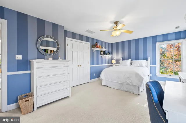 a room with pool table and wooden floor