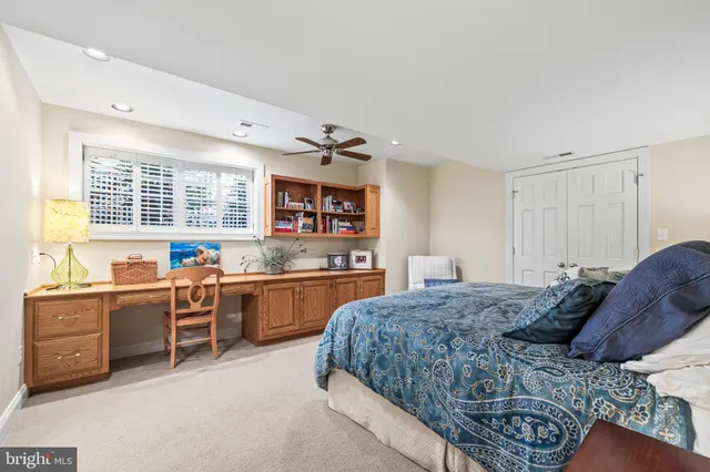 a view of a roof deck with table and chairs with wooden floor and fence