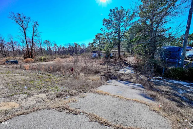 a view of a house with a tree