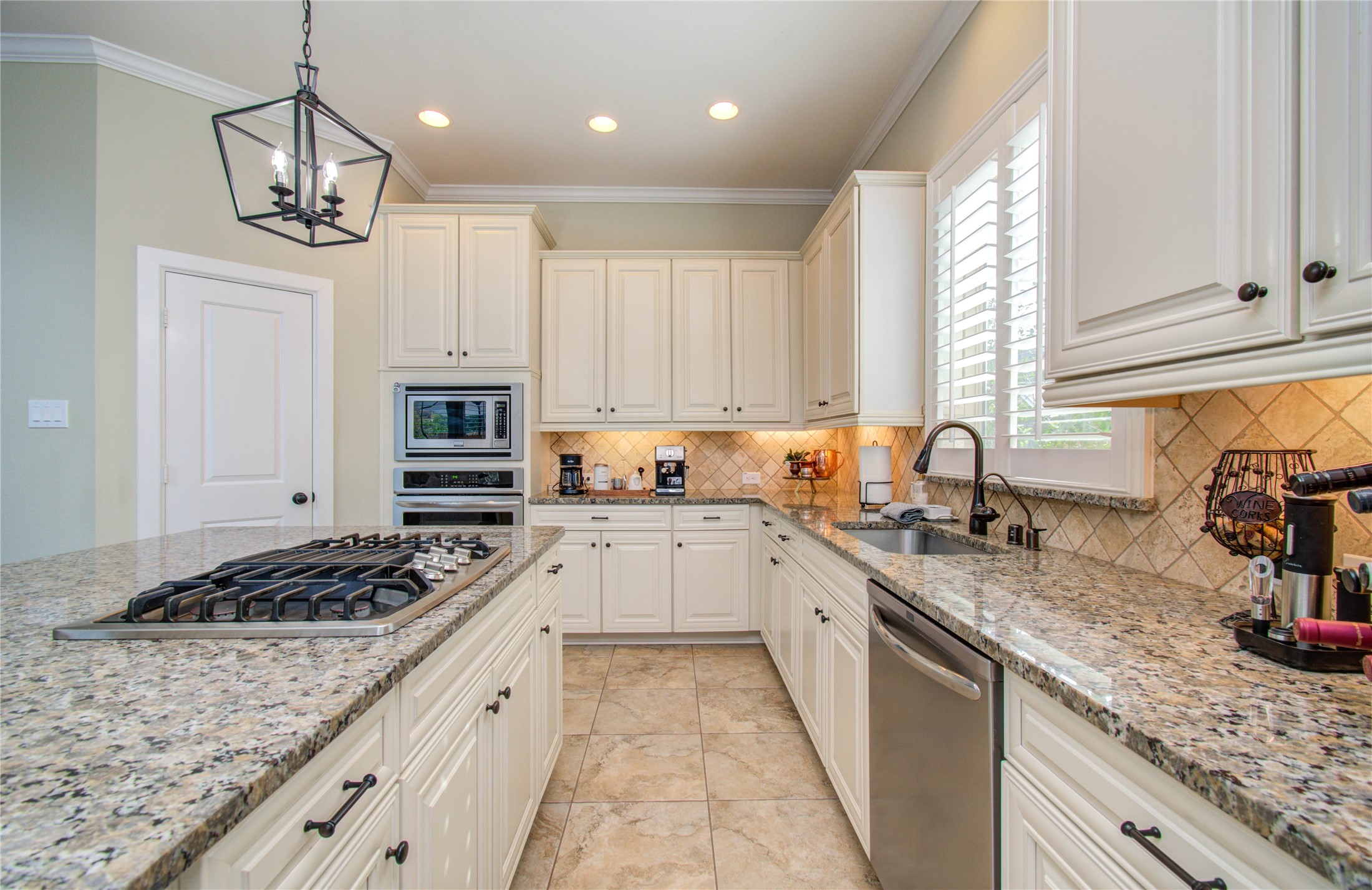 28627 Rolling Ridge Drive Katy, TX 77494 - Photo 18 of 44 a kitchen with stainless steel appliances granite countertop a sink stove and cabinets