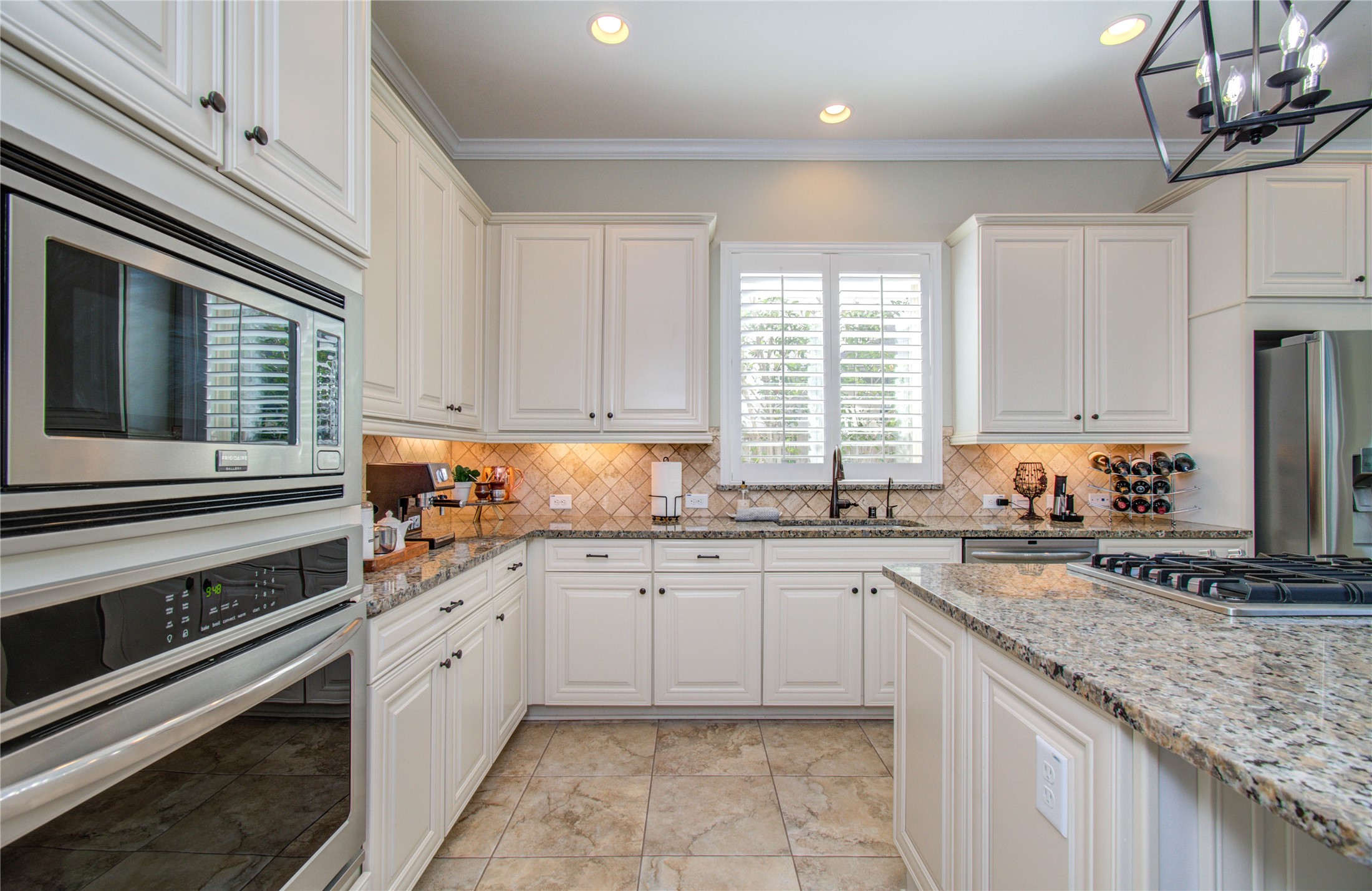 28627 Rolling Ridge Drive Katy, TX 77494 - Photo 19 of 44 a kitchen with a sink stove and cabinets
