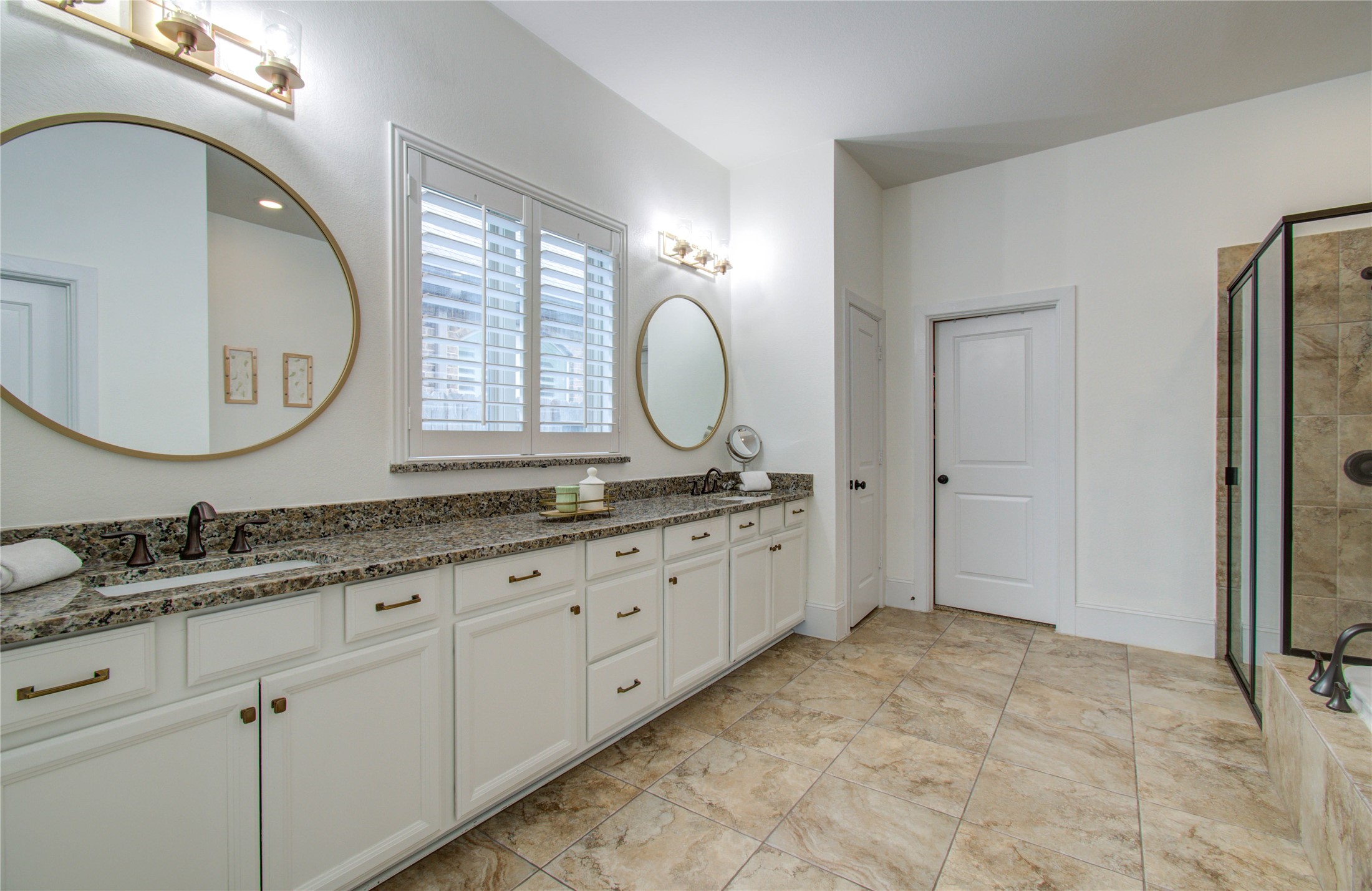 28627 Rolling Ridge Drive Katy, TX 77494 - Photo 24 of 44 a spacious bathroom with a granite countertop double vanity sink a mirror and a shower