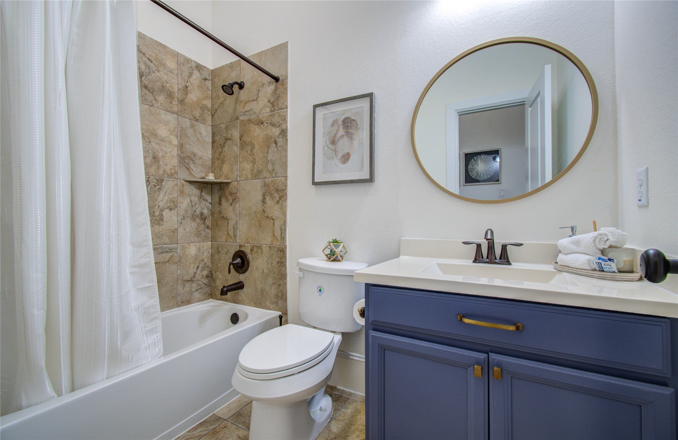 28627 Rolling Ridge Drive Katy, TX 77494 - Photo 27 of 44 a bathroom with a toilet a sink a mirror a bathtub and shower