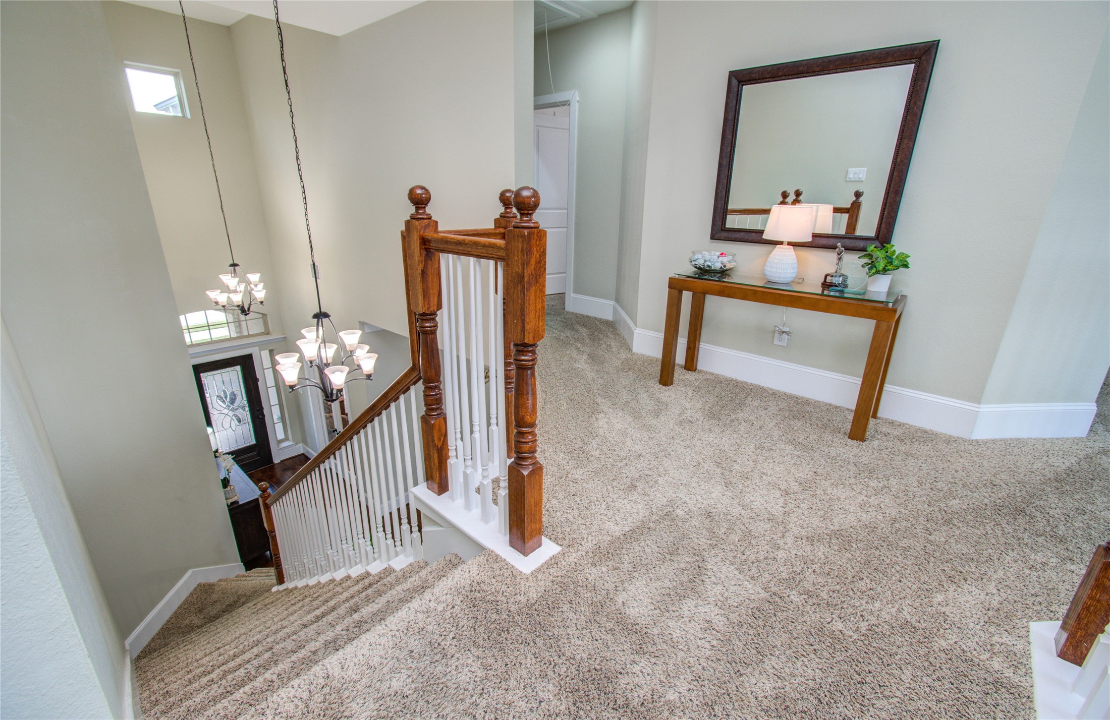 28627 Rolling Ridge Drive Katy, TX 77494 - Photo 29 of 44 a view of a hallway to room with wooden floor and stairs