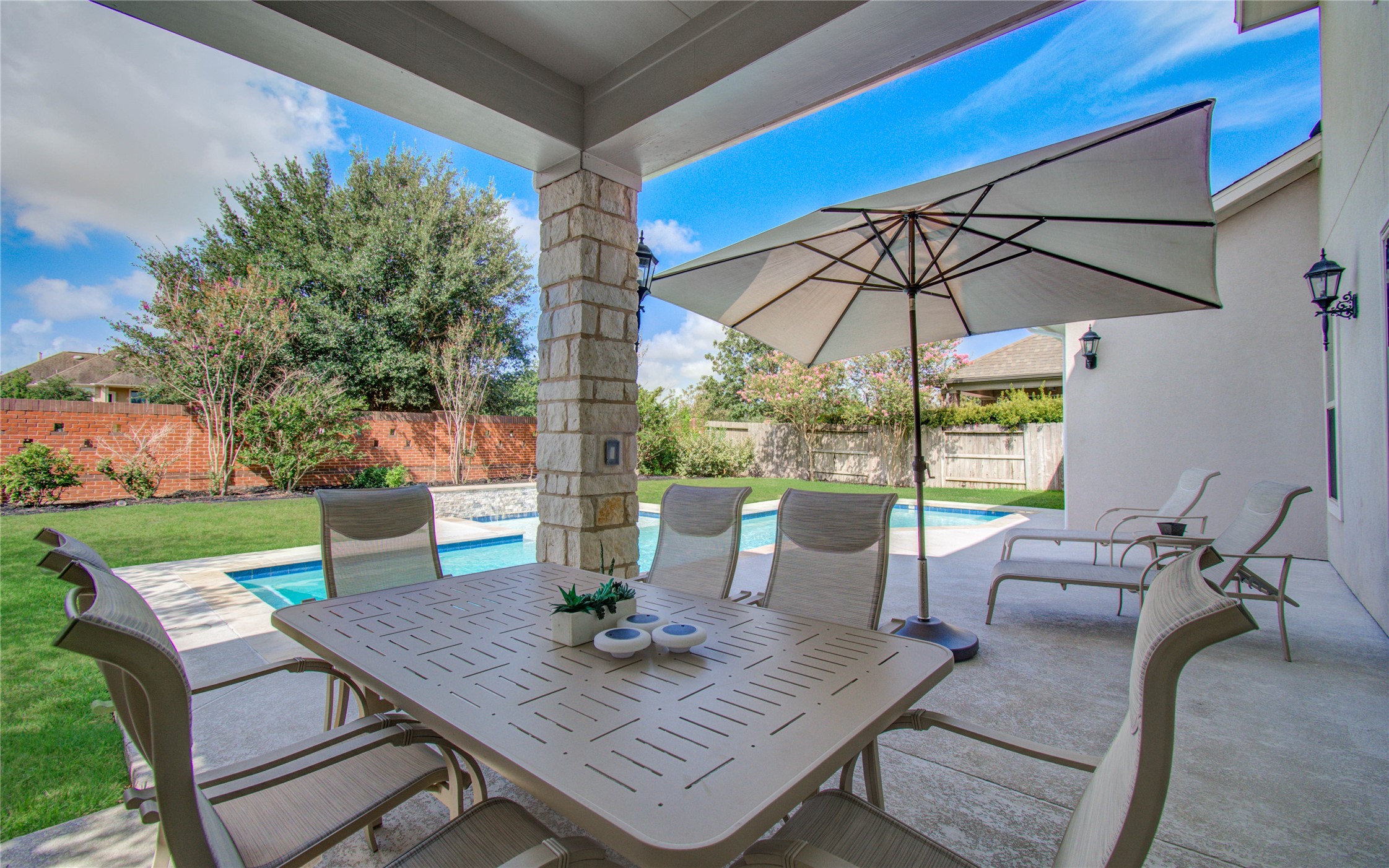 28627 Rolling Ridge Drive Katy, TX 77494 - Photo 38 of 44 a view of table and chairs under an umbrella
