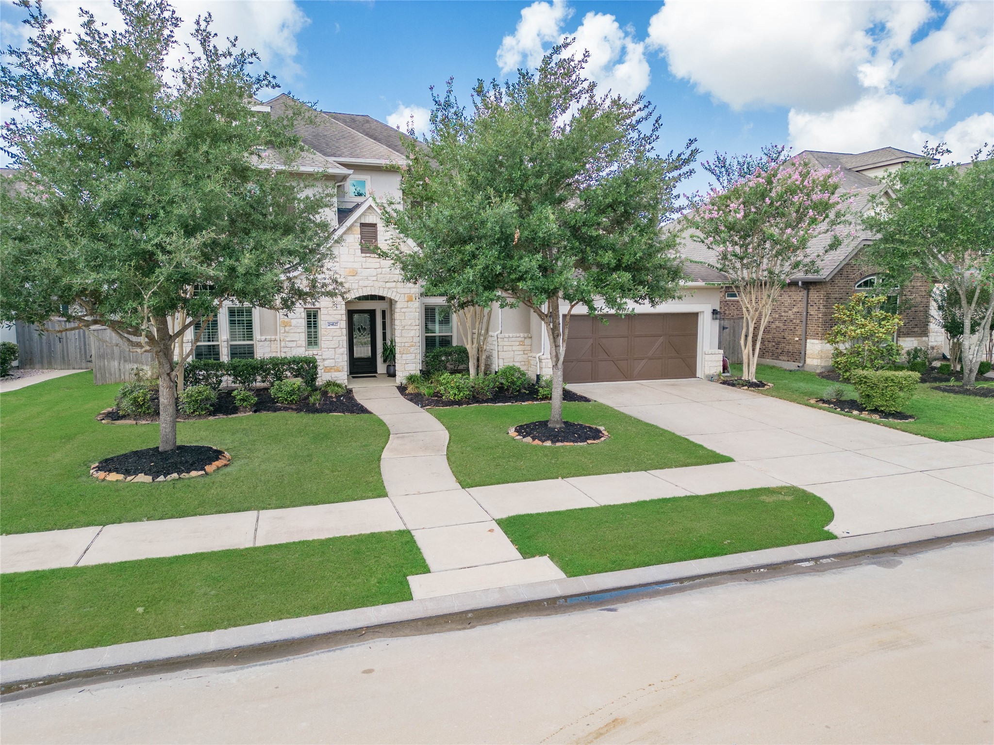 28627 Rolling Ridge Drive Katy, TX 77494 - Photo 6 of 44 a front view of a house with a yard and garage