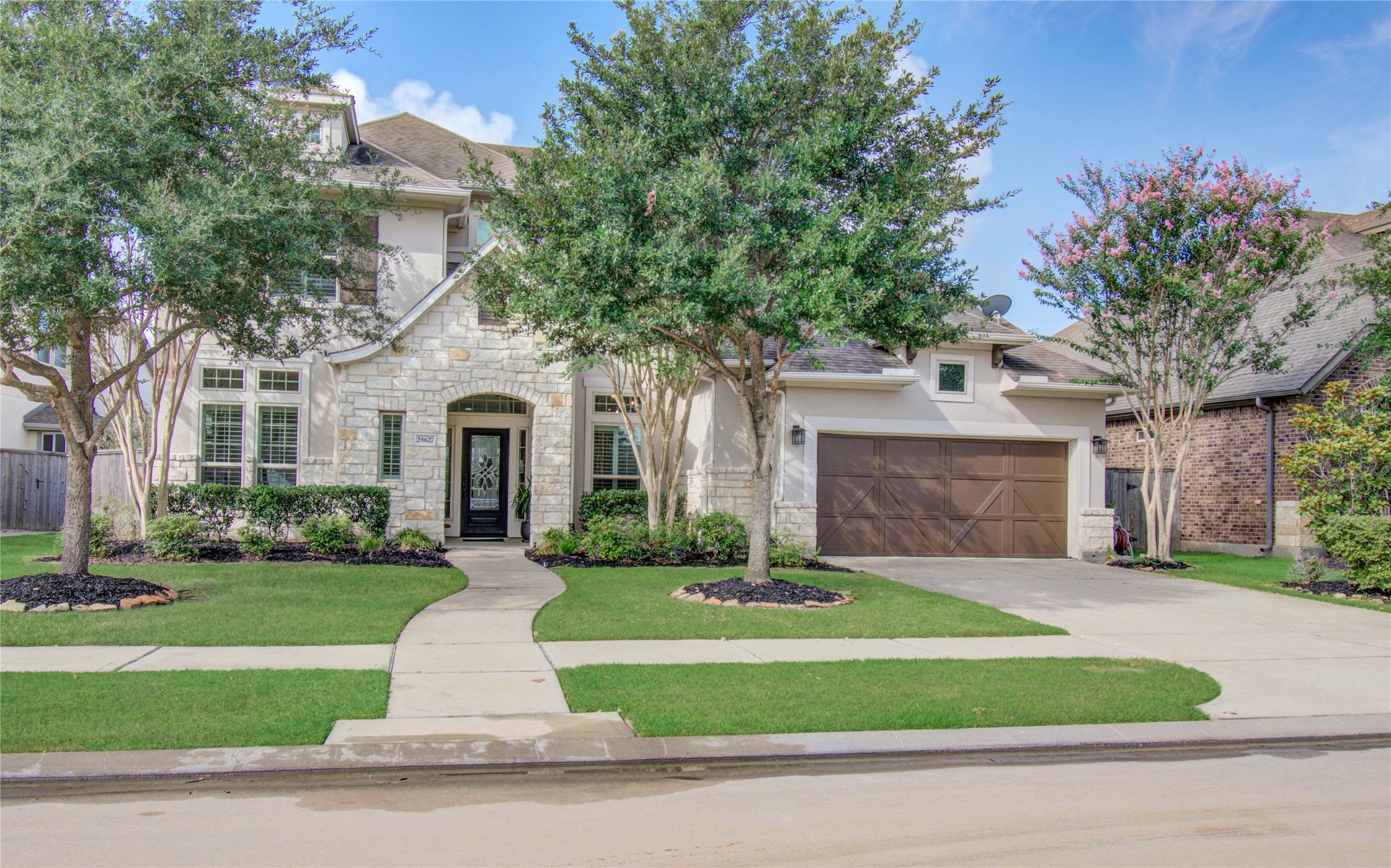 28627 Rolling Ridge Drive Katy, TX 77494 - Photo 7 of 44 a front view of a house with a yard and garage