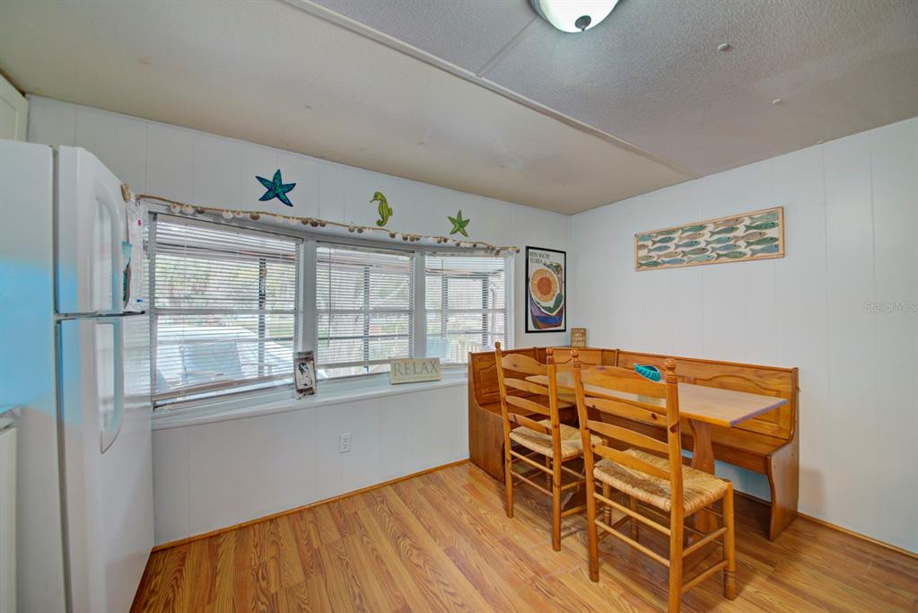 6427 West Richard Drive Weeki Wachee, FL 34607 - Photo 11 of 35 a blue bed sitting in a room next to a window