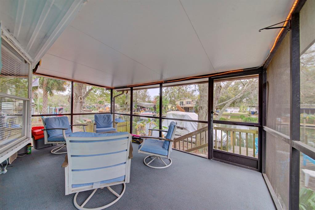 6427 West Richard Drive Weeki Wachee, FL 34607 - Photo 20 of 35 a room with pool table and a large window