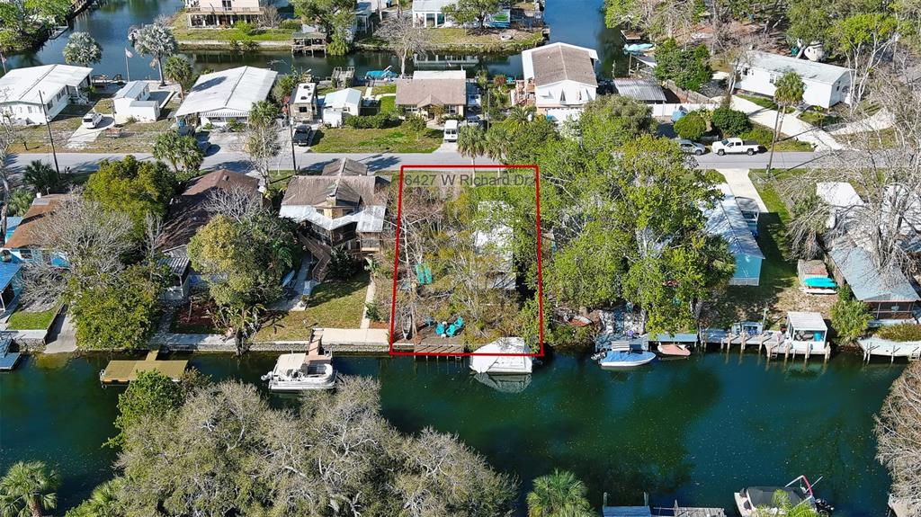 6427 West Richard Drive Weeki Wachee, FL 34607 - Photo 26 of 35 a view of a lake with houses