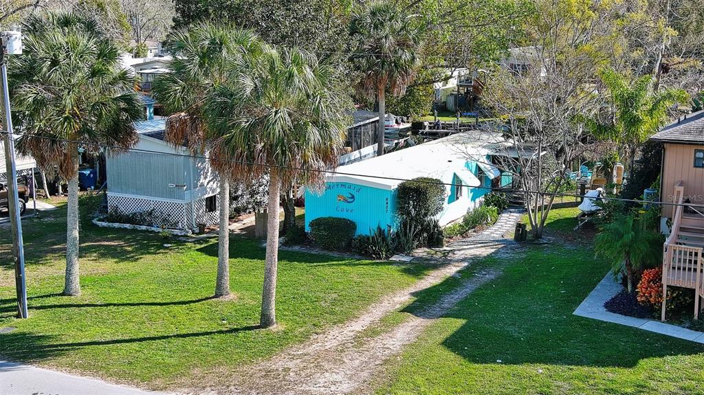 6427 West Richard Drive Weeki Wachee, FL 34607 - Photo 30 of 35 a view of a house with a yard