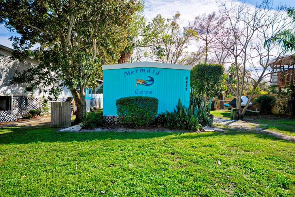 6427 West Richard Drive Weeki Wachee, FL 34607 - Photo 32 of 35 a view of a house with a yard and tree s