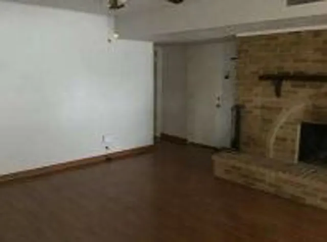 an empty room with a fireplace