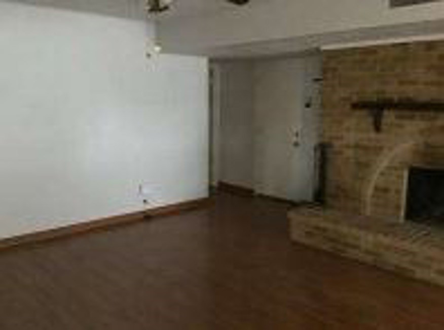 5052 South Colony Boulevard The Colony, TX 75056 - Photo 2 of 9 an empty room with a fireplace
