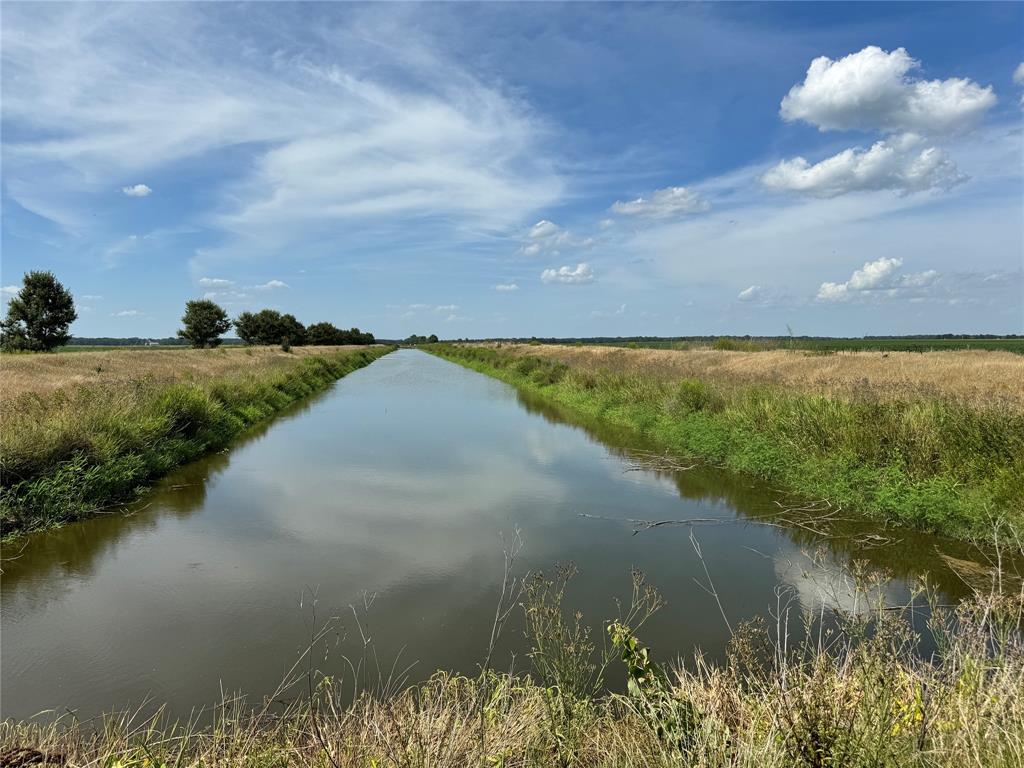 9434 33 N Highway Roe, AR 72134 - Photo 21 of 39 a view of a lake from a yard