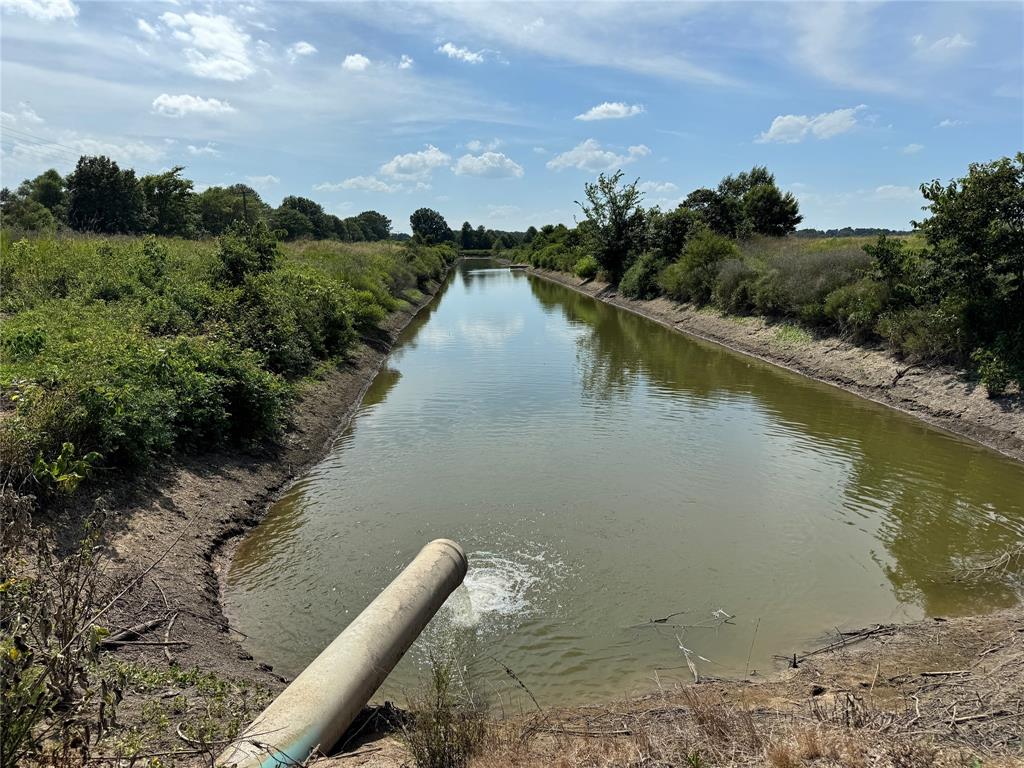 9434 33 N Highway Roe, AR 72134 - Photo 22 of 39 a view of a lake with a yard