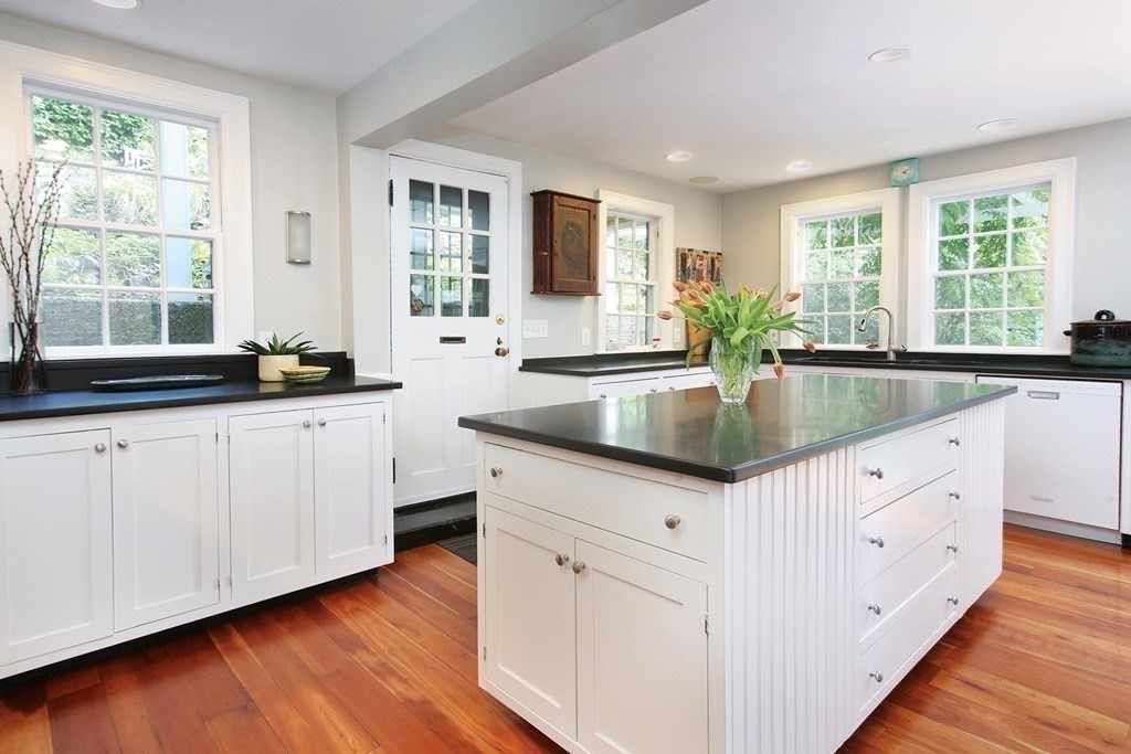 156 Carlton Road Newton, MA 02468 - Photo 5 of 23 a kitchen with granite countertop a sink and cabinets