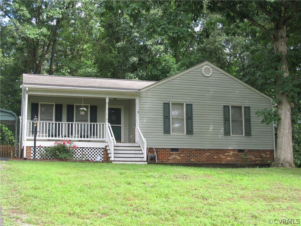11018 Rufford Road Chester, VA 23831 - Photo 1 of 23 a front view of a house with garden