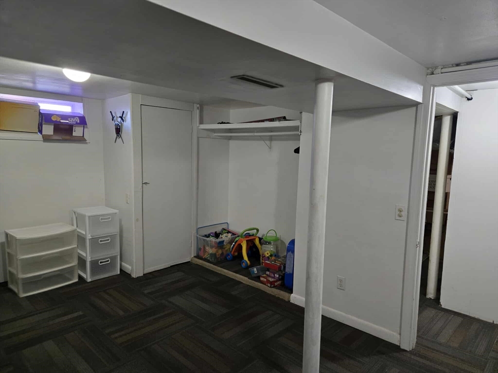 78 San Miguel Street Springfield, MA 01104 - Photo 12 of 26 a view of a hallway with wooden floor and closet area