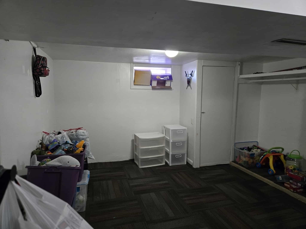 78 San Miguel Street Springfield, MA 01104 - Photo 15 of 26 a bedroom with furniture and a window