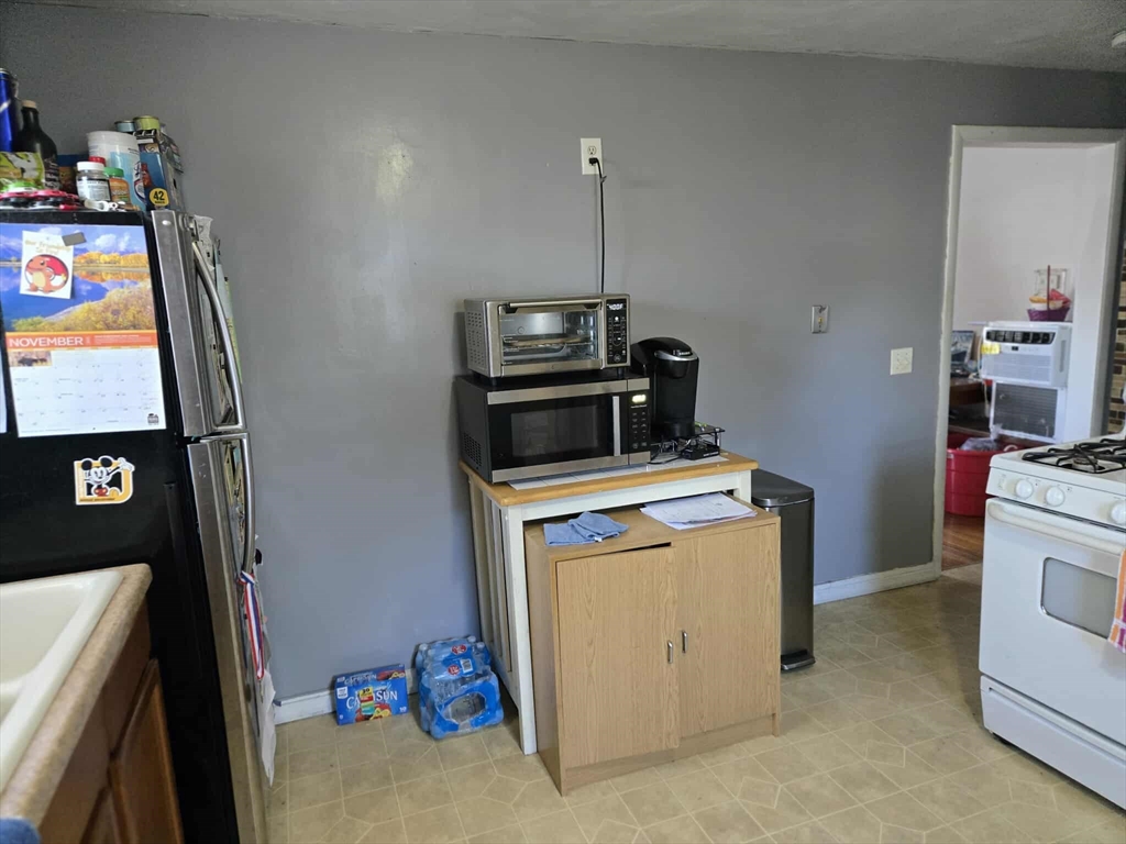 78 San Miguel Street Springfield, MA 01104 - Photo 17 of 26 a view of storage and utility room with washer and dryer